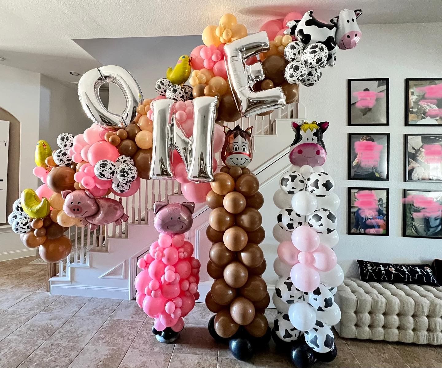 a room filled with lots of balloons and a staircase