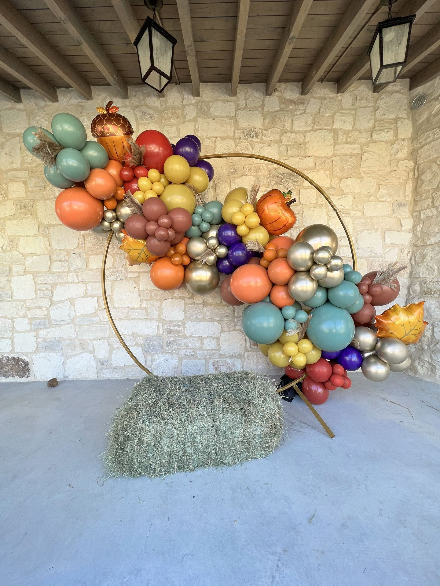 a bunch of balloons are hanging from the ceiling in a room