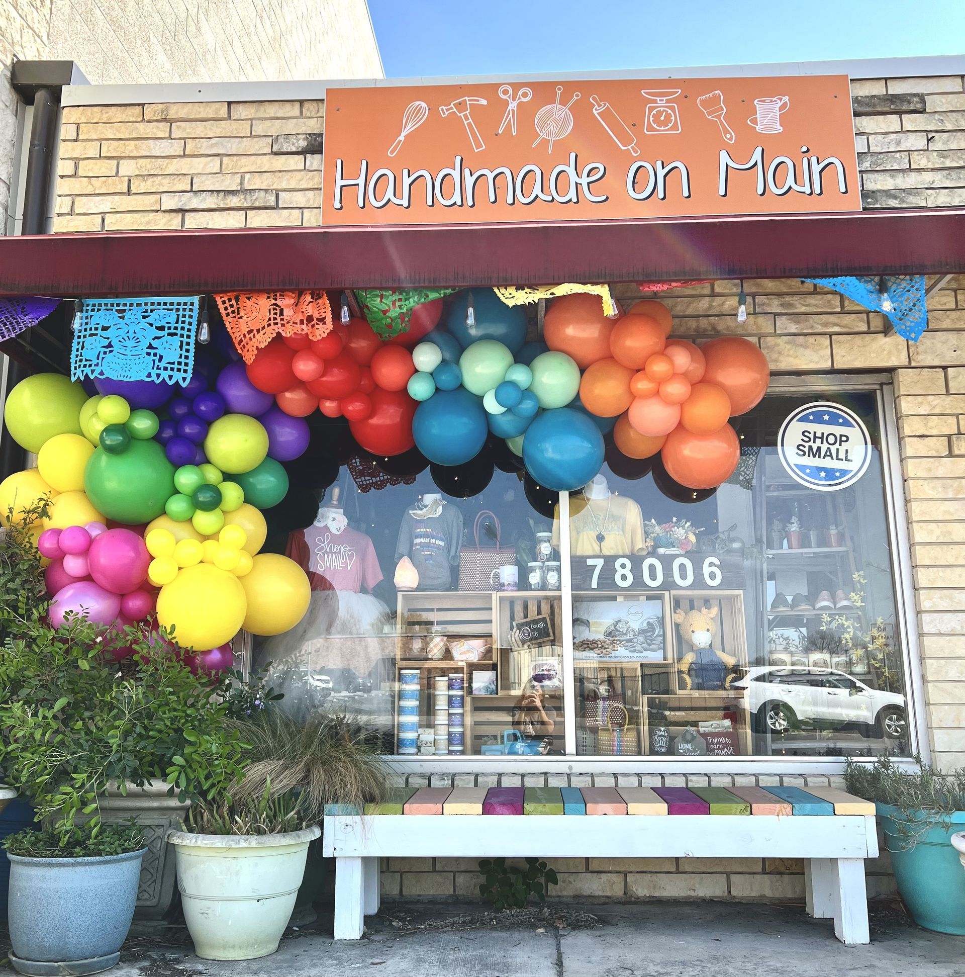 a store front with a sign that says handmade on main