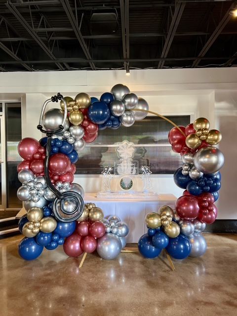 A bunch of balloons are sitting on a table in a room.