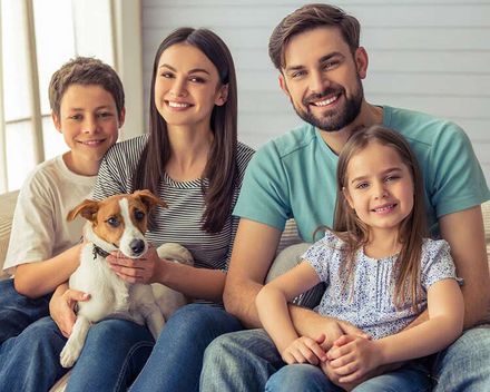 Family Smiling with their Dog - Life Insurance in Livingston, MT
