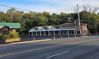 Freshly paved commercial parking lot with clear line markings and smooth asphalt surface