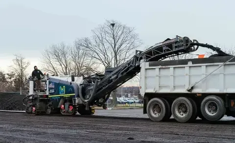 Professional asphalt milling service in action, extracting damaged pavement for smooth resurfacing