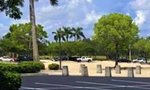 Crew performing asphalt repair and maintenance on a cracked driveway with professional equipment