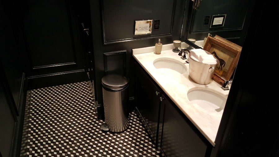 Sink — White Sink with Black and White Tile Flooring in North Charleston, SC