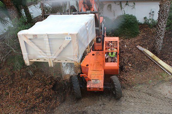 Skytrak — Skytrak Carrying a Crate Outdoors in North Charleston, SC