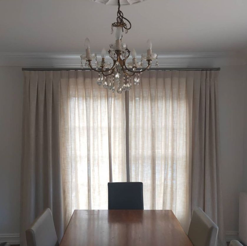 Table and chairs with chandelier - Curtains in Welby, NSW
