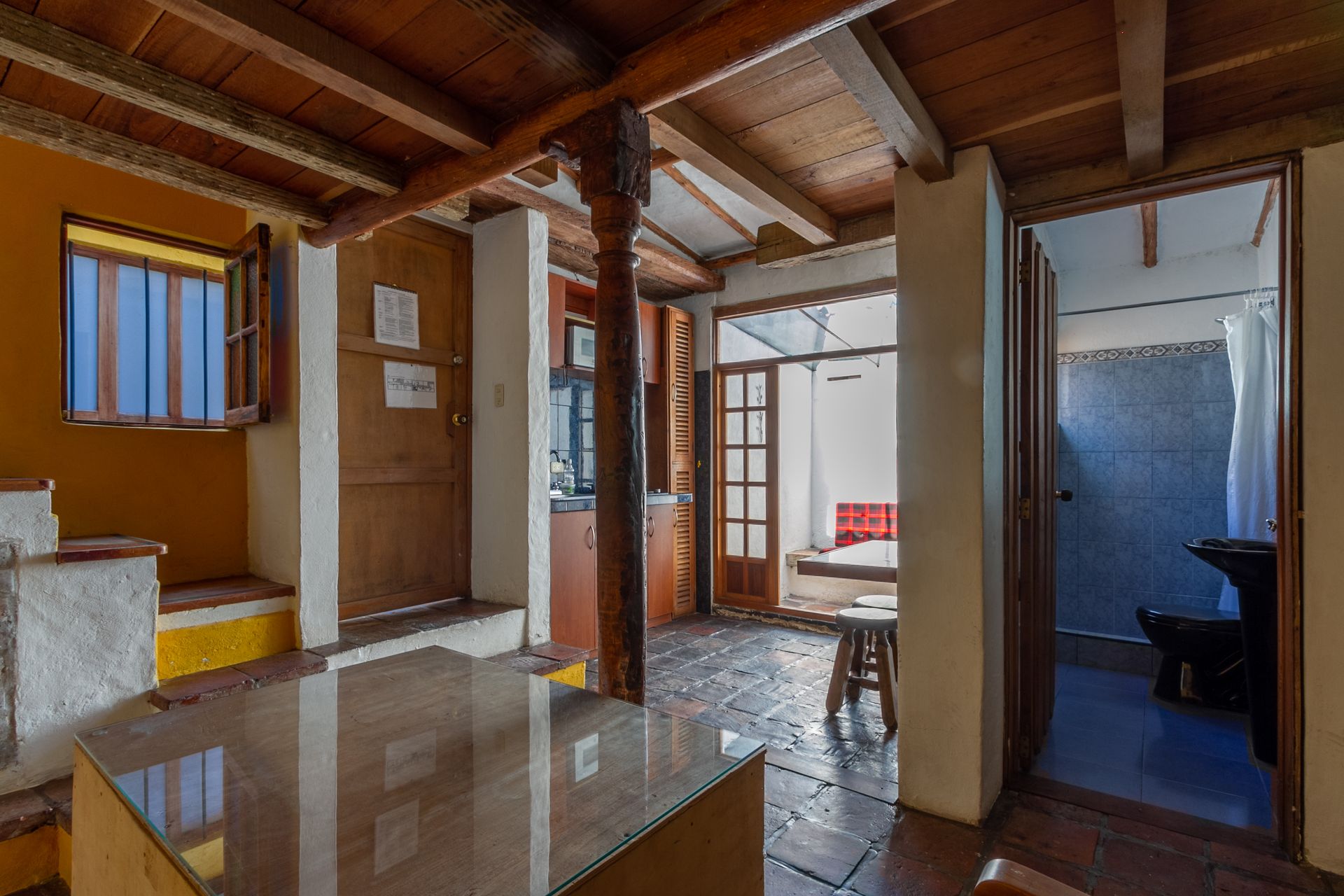 There is a table in the middle of the room.