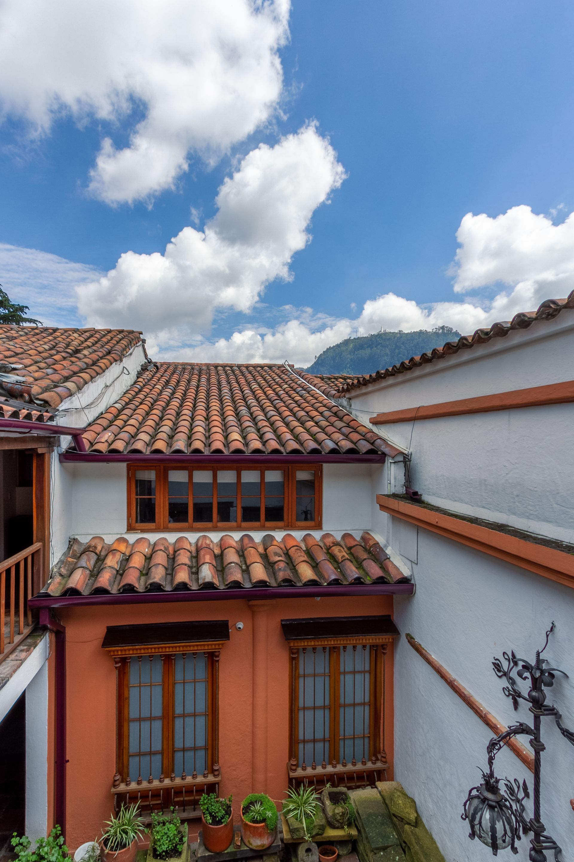 A house with a tiled roof and a lot of windows