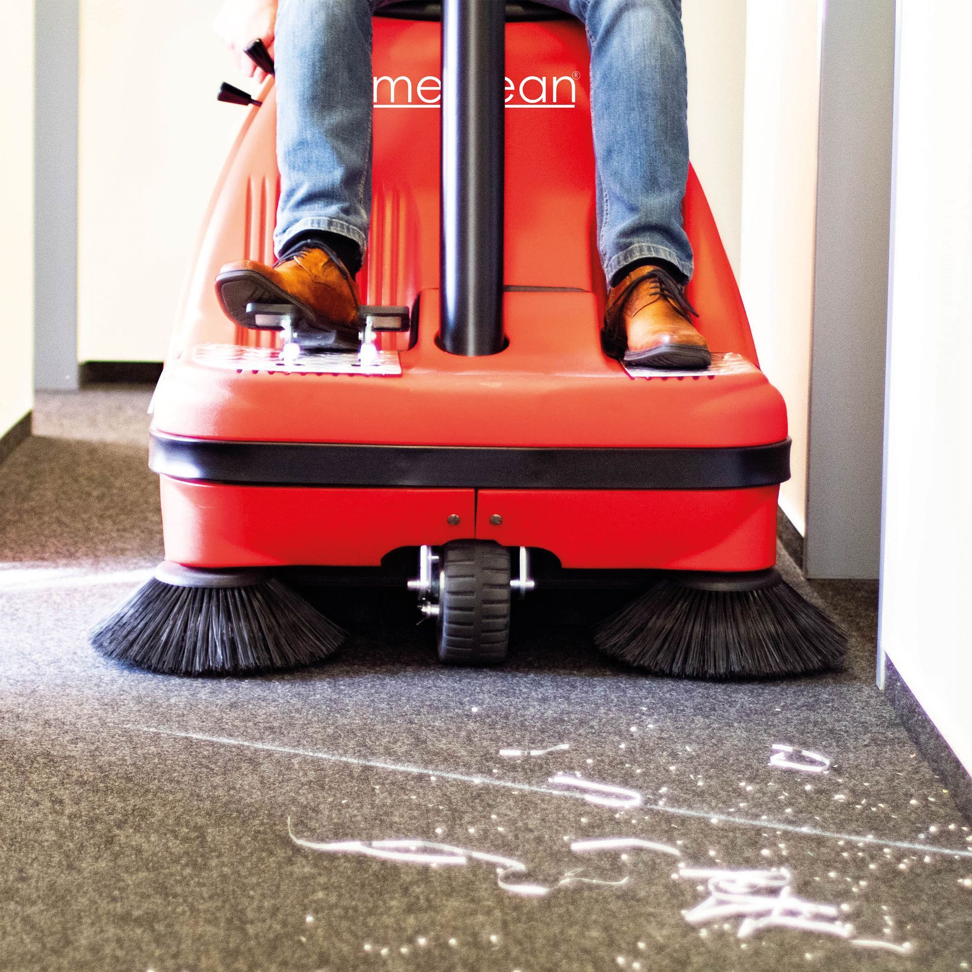 Meclean professional ride-on sweeper Buster 1000TTE sweeping in office