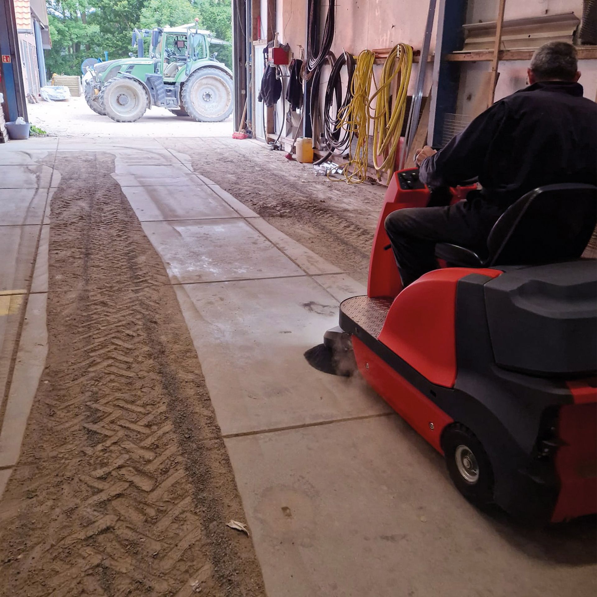 Meclean ride-on sweeper BUSTER 1150 sweeping in farm