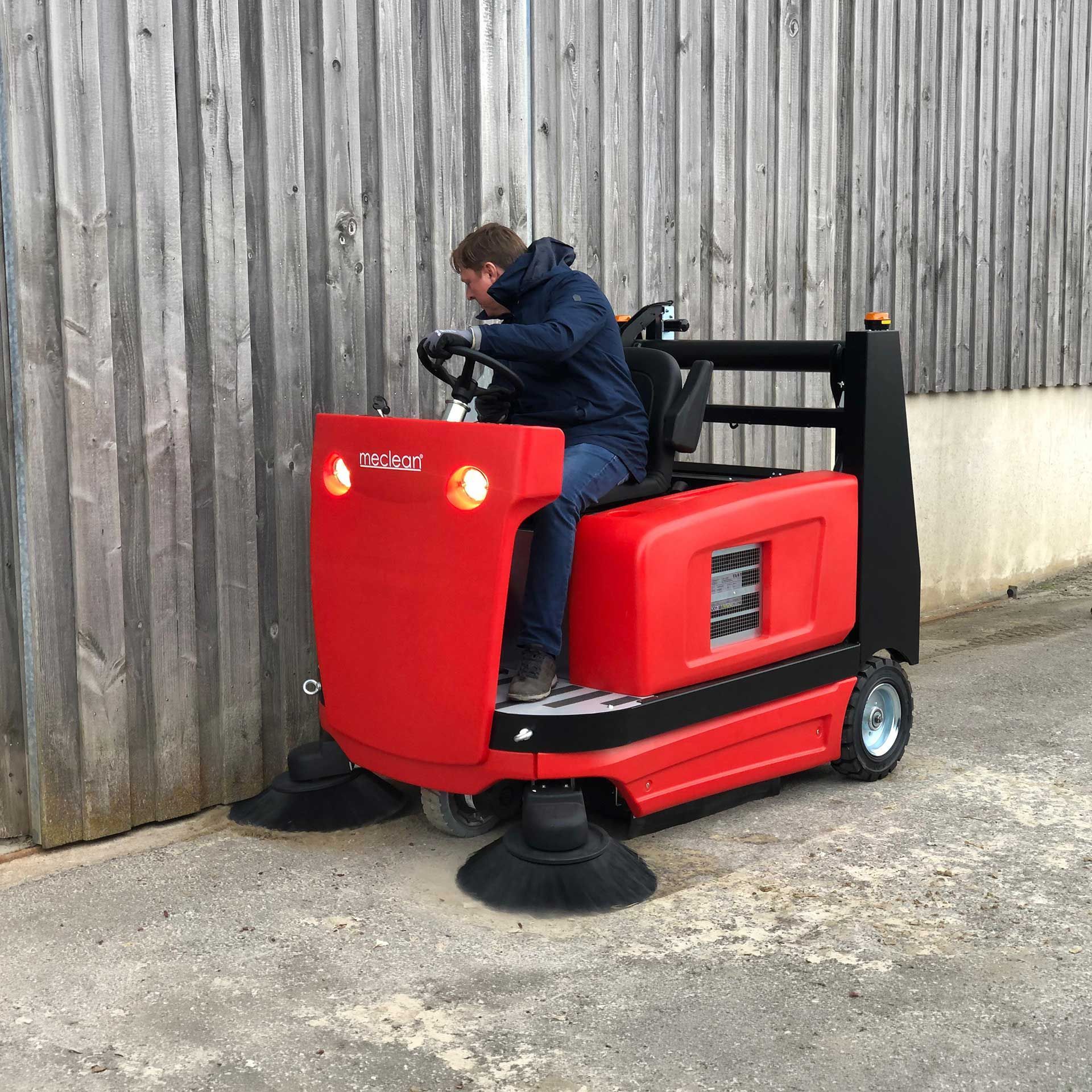 Meclean industrial sweeper diesel powered drive BUSTER 1300TTD sweeping along edge horse arena