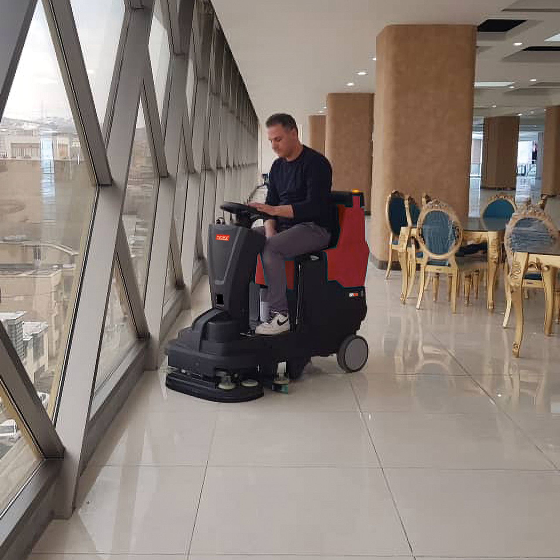 Meclean ride-on scrubber-dryer POWERSCRUB R65D in shopping centre on tile floor