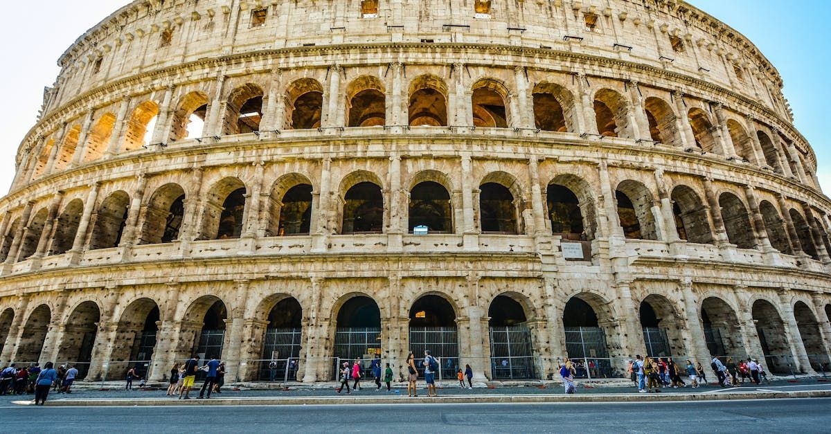 The colosseum in rome is a very large building with a lot of arches.