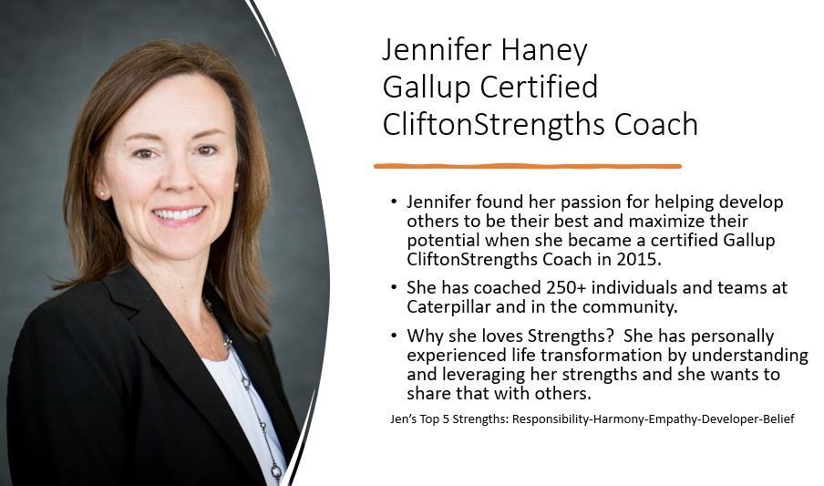 A woman in a suit is standing in front of a sign that says jennifer haney gallup certified clifton strengths coach
