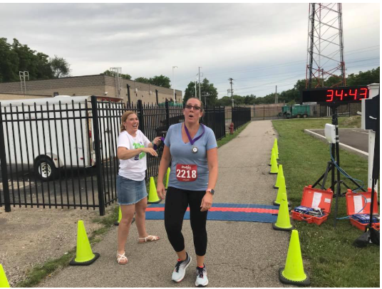 A woman wearing a shirt with the number 2218 on it