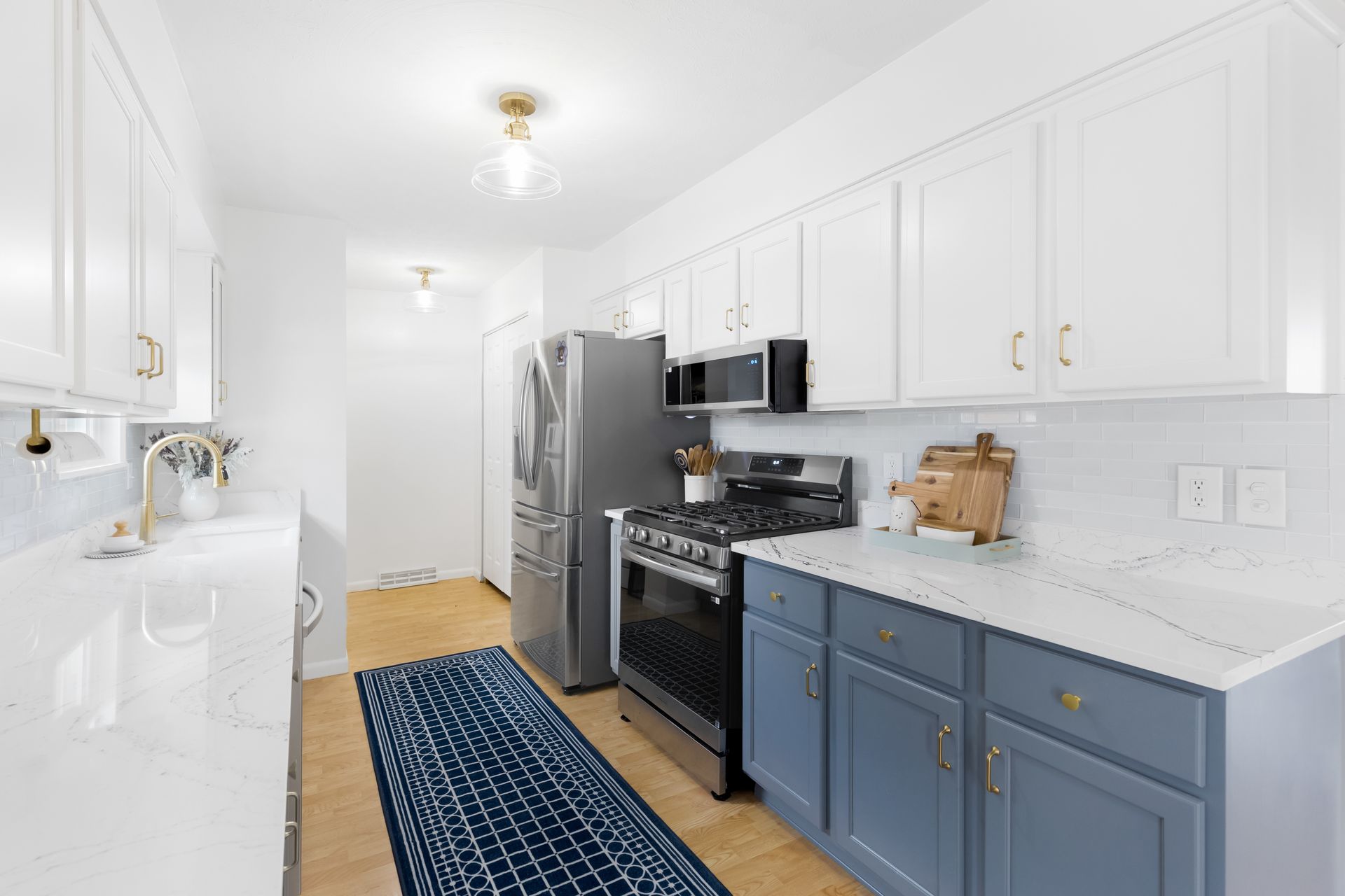 Custom Built Cabinets, Upper - Swiss Coffee, Lower - Storm Cloud, Cambria Potrush Countertops by Counter Culture