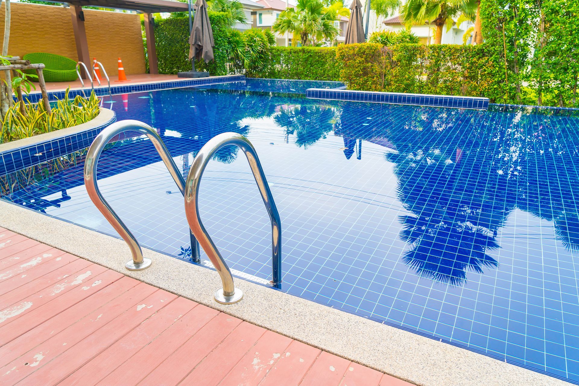 A large swimming pool with stairs leading to it