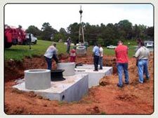 Septic Tank Installation — Workers Installing Septic Tank in Shelby, NC