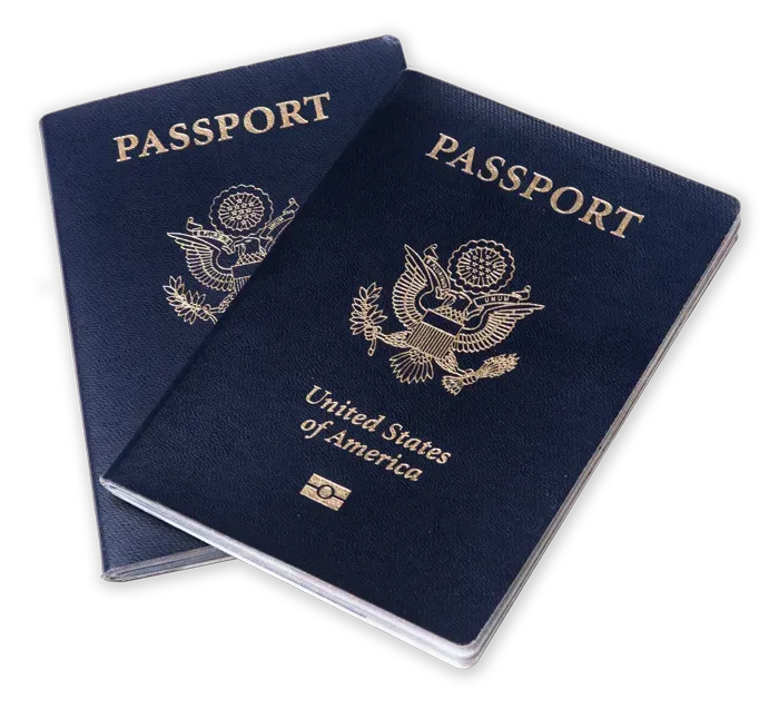 Two blue United States passports with gold seals, stacked slightly apart on a white background