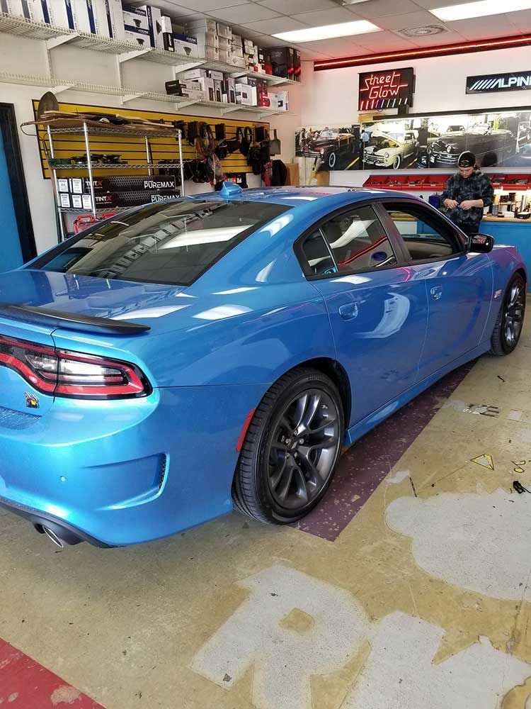 Blue car in auto shop.
