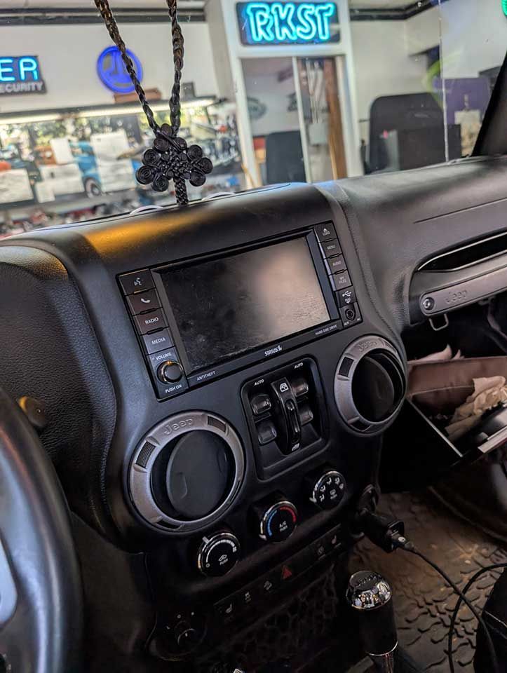 Black car dashboard with installed touchscreen display