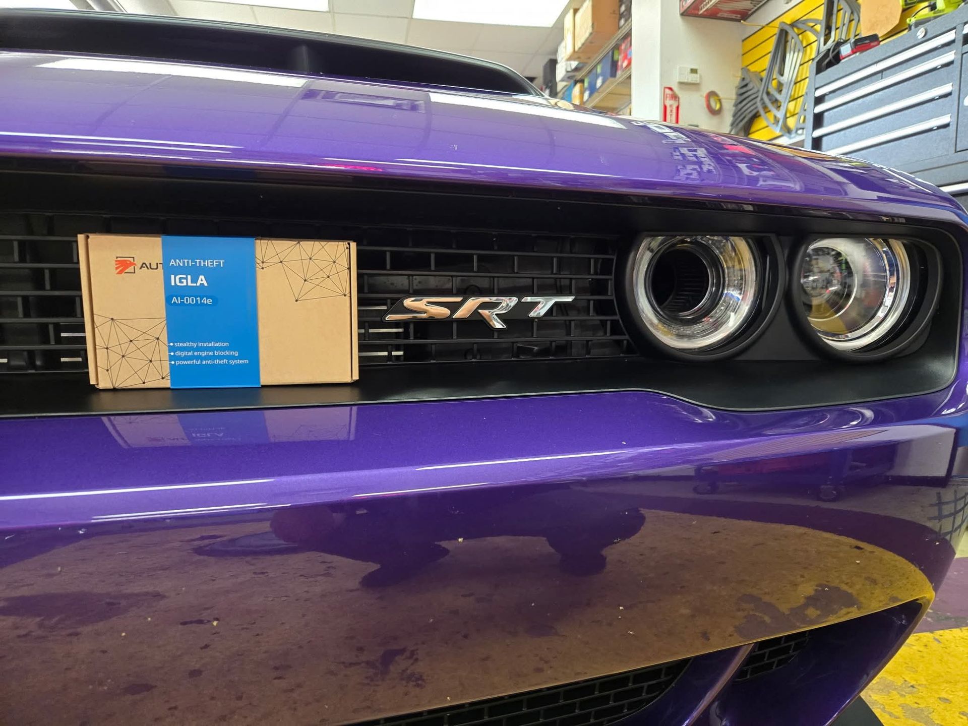 Auto electrician is working with car wiring close up. 
