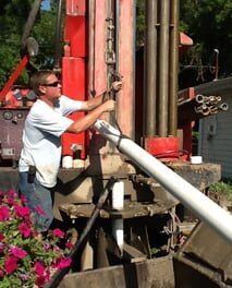 A professional doing water well drilling installation in Crown Point, IN