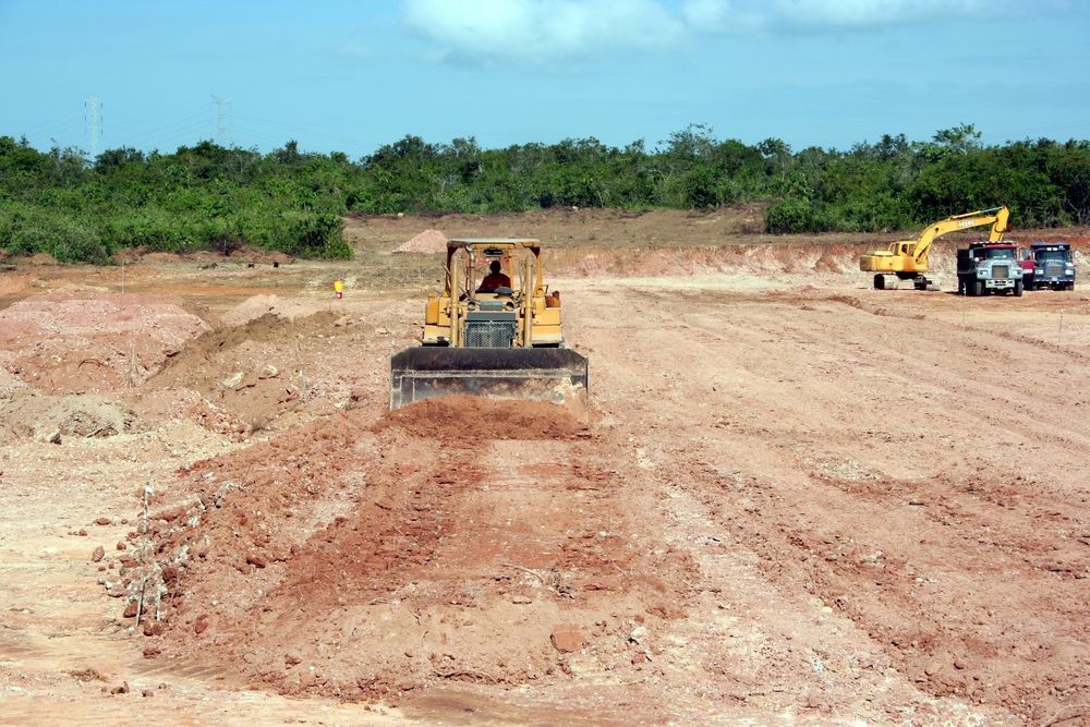 Bulldozer Leveling Dirt at a Construction Site — Macca's Dynamic Earthworks in Tolga, QLD