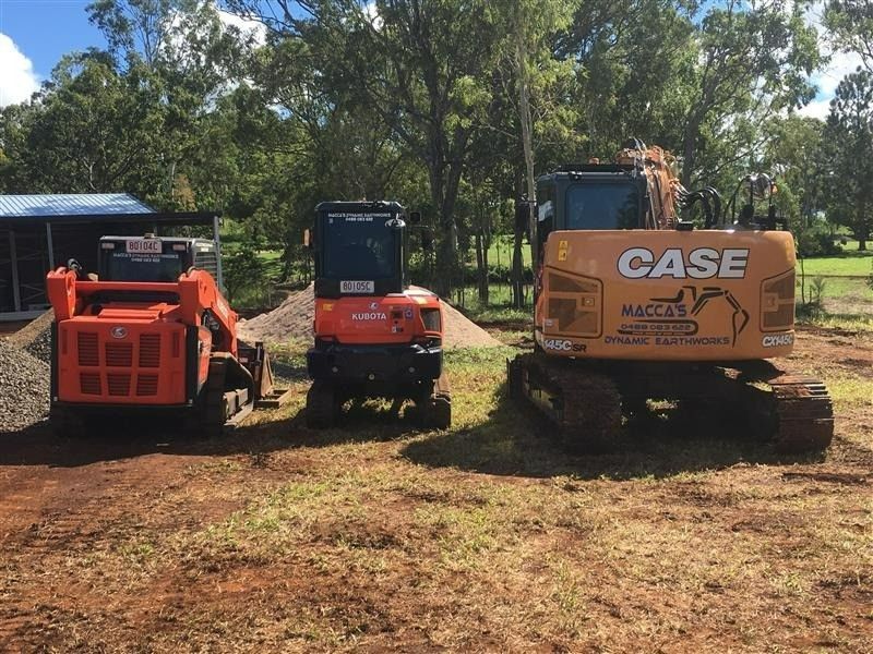 Three Construction Vehicles Parked on Dirt — Macca's Dynamic Earthworks in Tolga, QLD