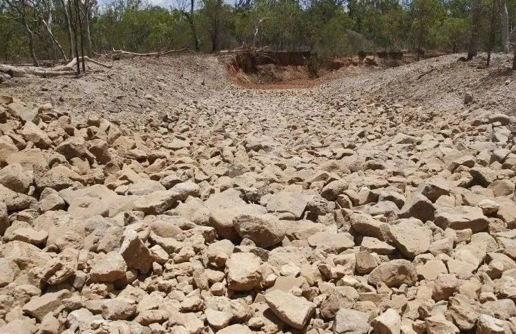 Dry Waterway with Brown and Tan Stones — Macca's Dynamic Earthworks in Tolga, QLD