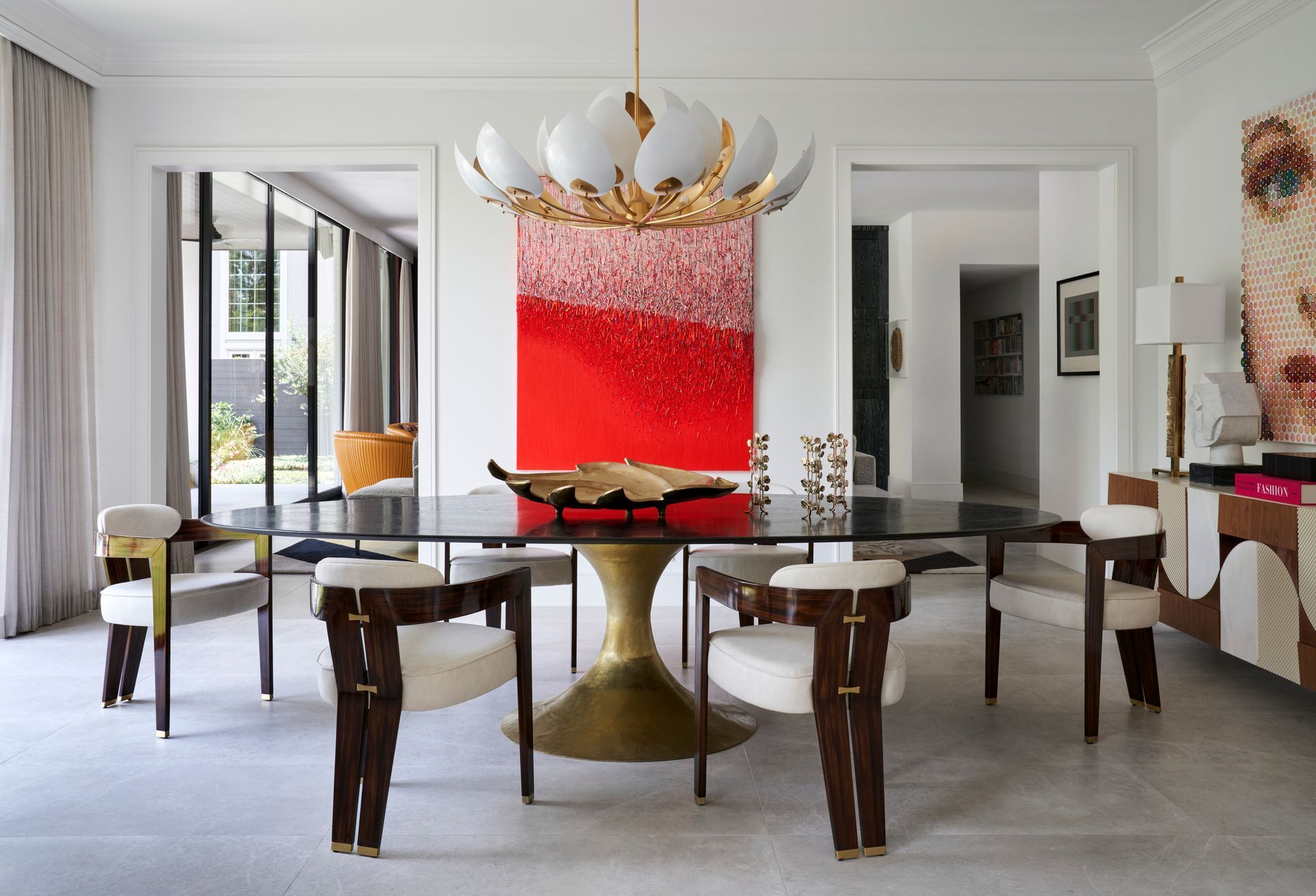 a dining room with a table and chairs and a chandelier