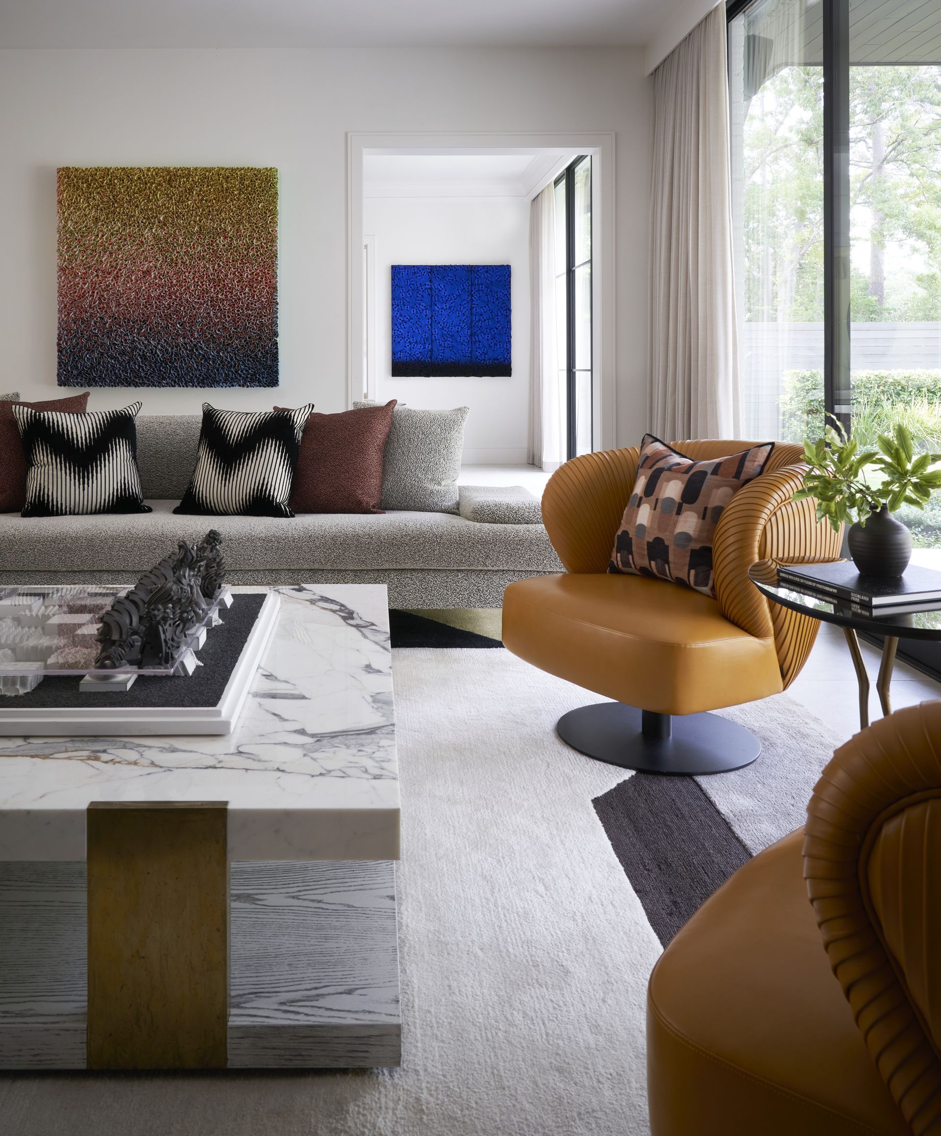 a living room with a couch a chair and a coffee table