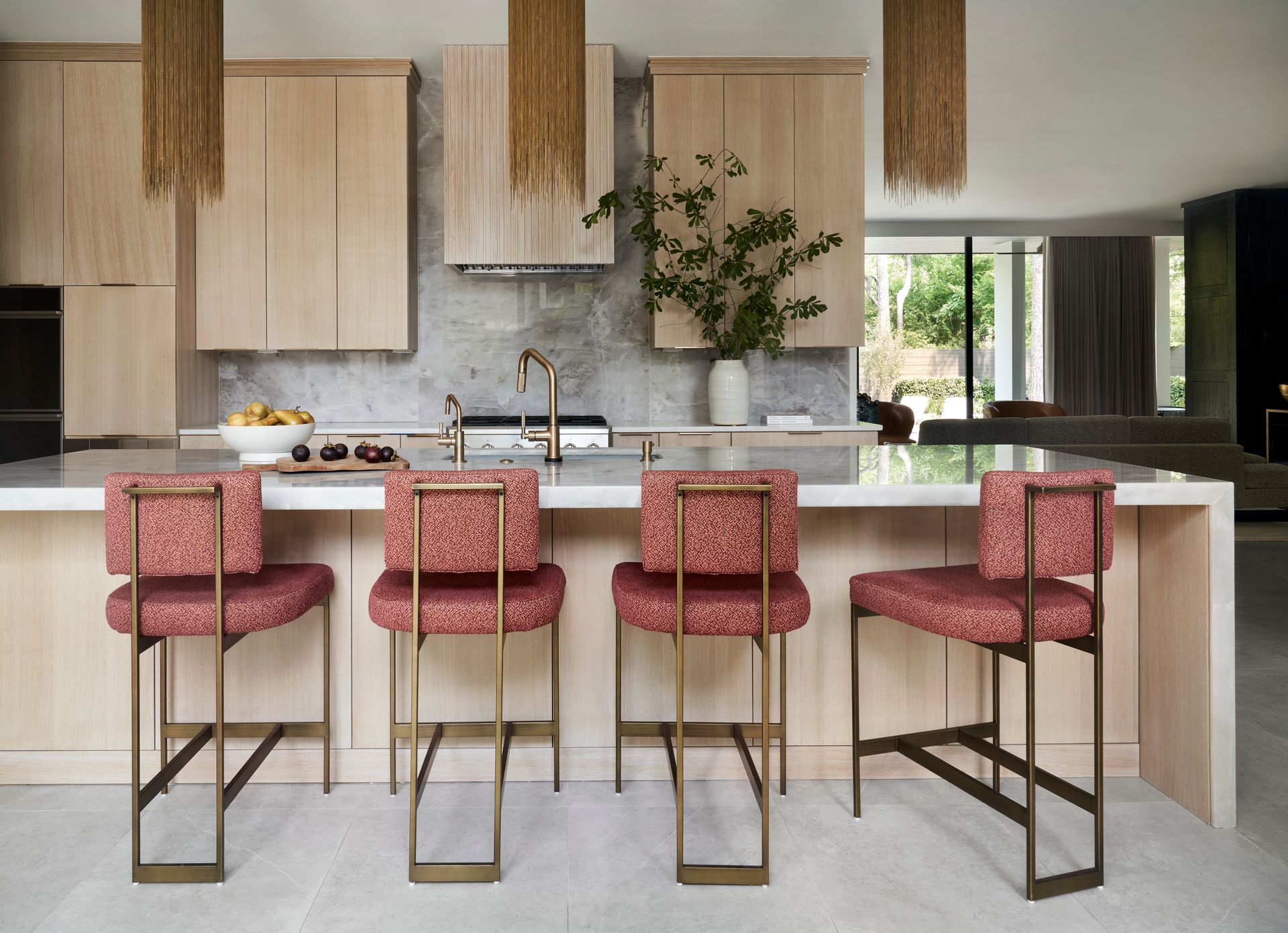 a dining room with a table and chairs and a painting of a woman 's face on the wall .
