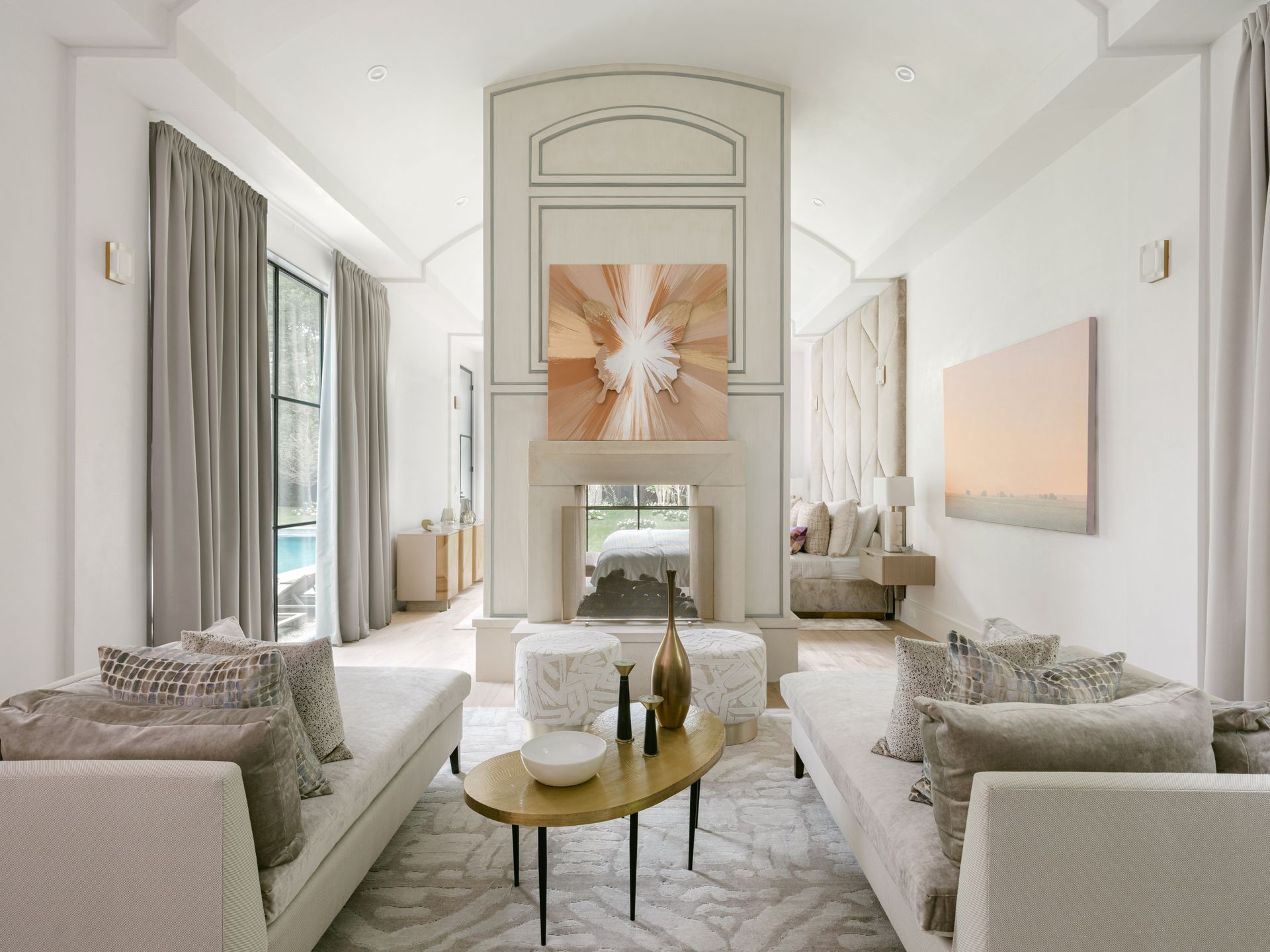 A living room filled with furniture and a fireplace.