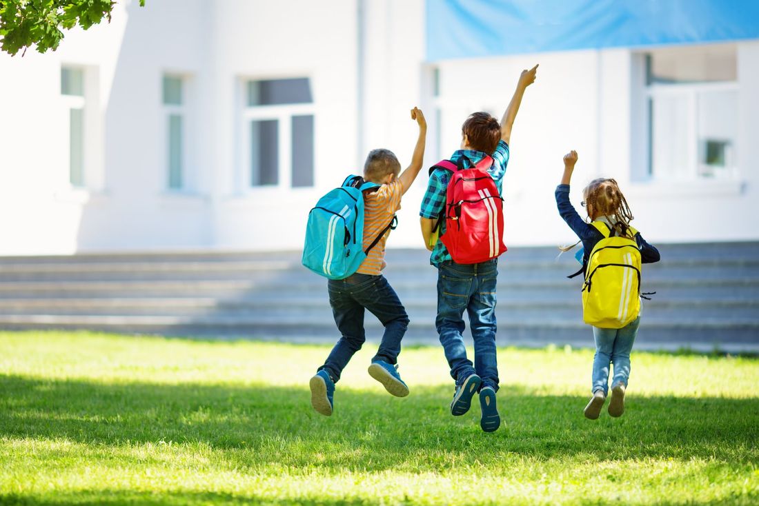 happy children entering school