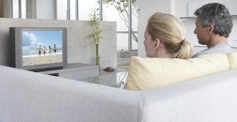 Couple enjoying time together while watching TV