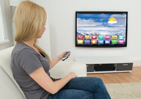 Lady watching TV after IPTV  setup service in Nelson
