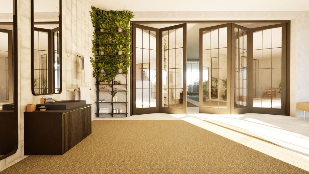 An artist 's impression of a lobby with sliding glass doors.