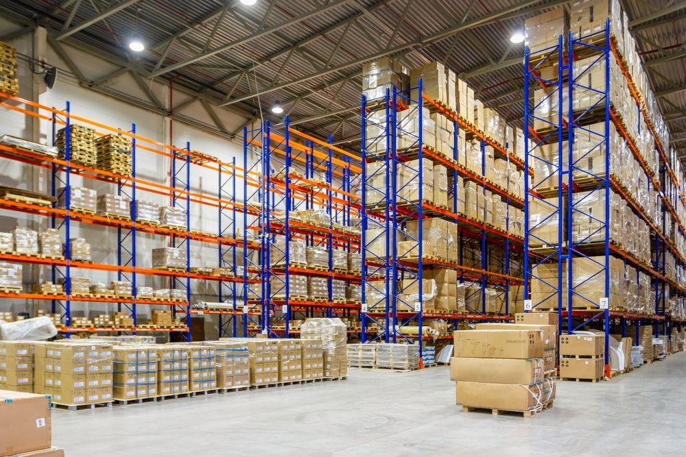 A large warehouse filled with lots of boxes and shelves.