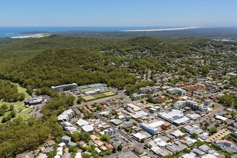 Aerial View of a Small Town Surrounded by Trees and Buildings — KeyBay in Edmonson Park, NSW