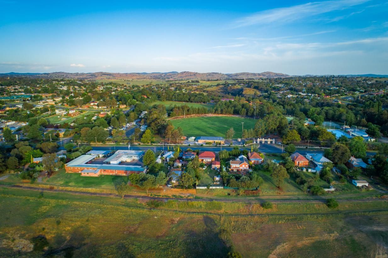 Aerial View of a Small Town With a Field in the Middle of It — KeyBay in Robertson, NSW