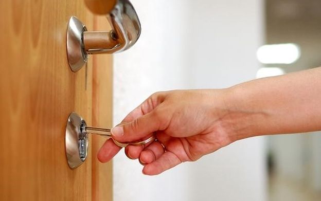 Person is Opening a Door With a Key — KeyBay in Mittagong, NSW