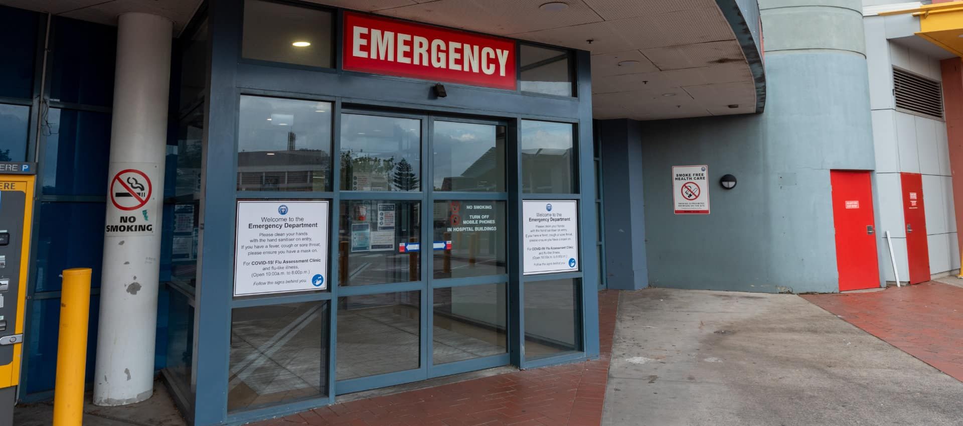 An Emergency Entrance to a Hospital With a Red Sign Above It — KeyBay in Fitzroy Falls, NSW