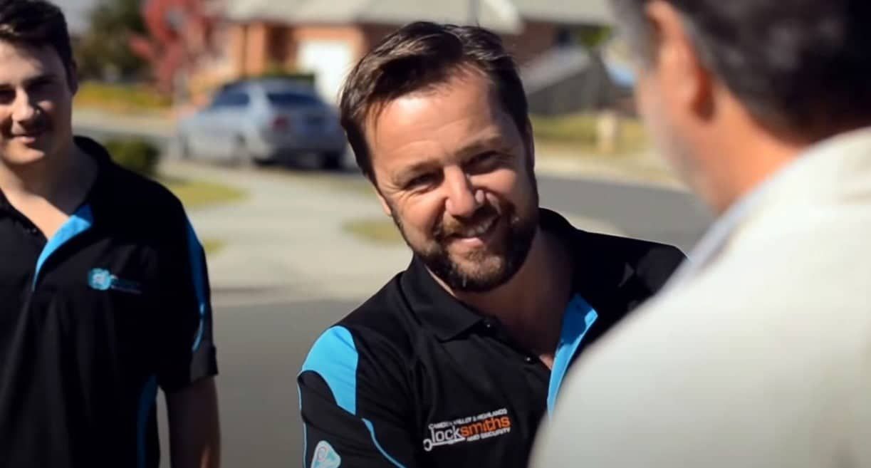 Man With a Beard is Smiling While Talking to Two Other Men — KeyBay in Mittagong, NSW