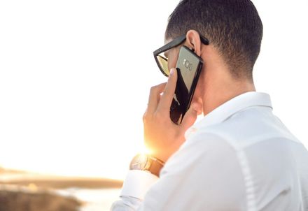 Male holding a phone to his ear