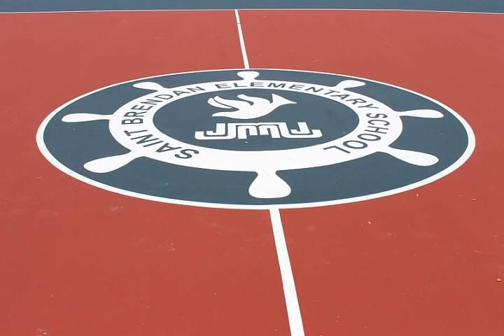 A basketball court with a logo for saint john 's elementary school