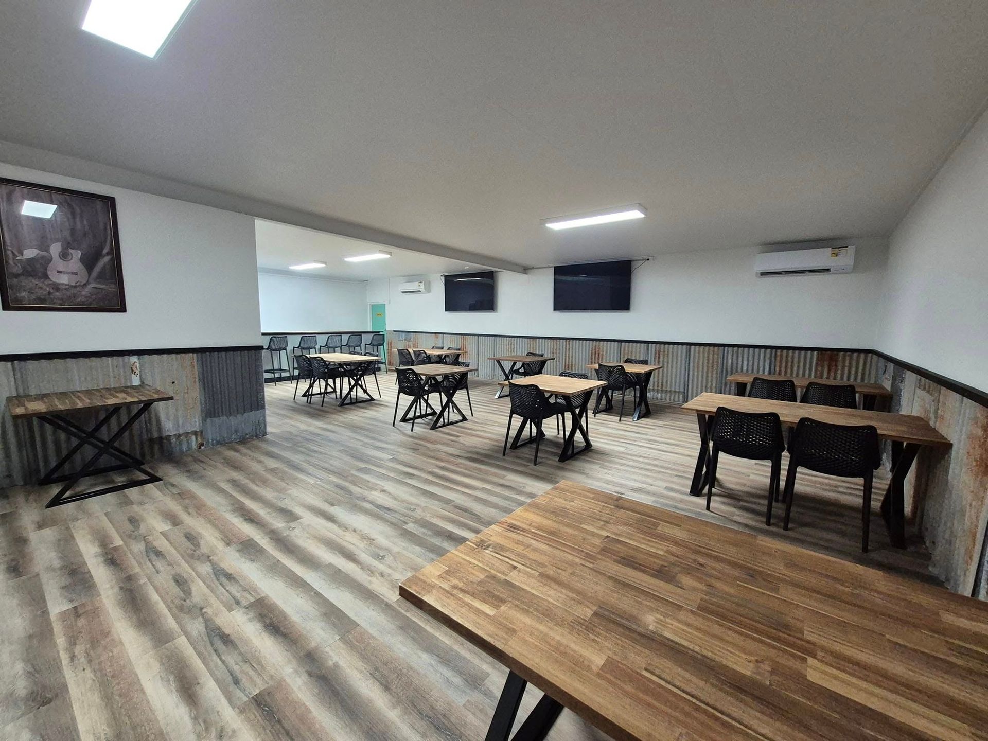 Interior of a Restaurant With Wooden Tables and Chairs, and Wood-look Flooring — Bluewater Diner in Bluewater, QLD