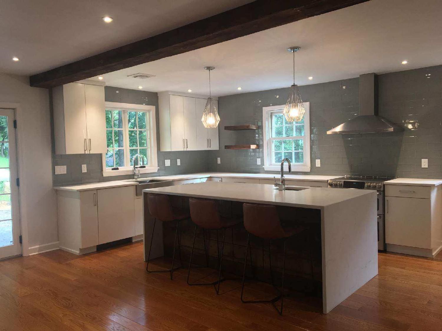 A kitchen with a large island in the middle of the room.