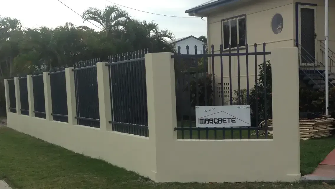 A House With A Fence And A Sign In Front Of It — Mascrete Pty Ltd In Hermit Park, QLD